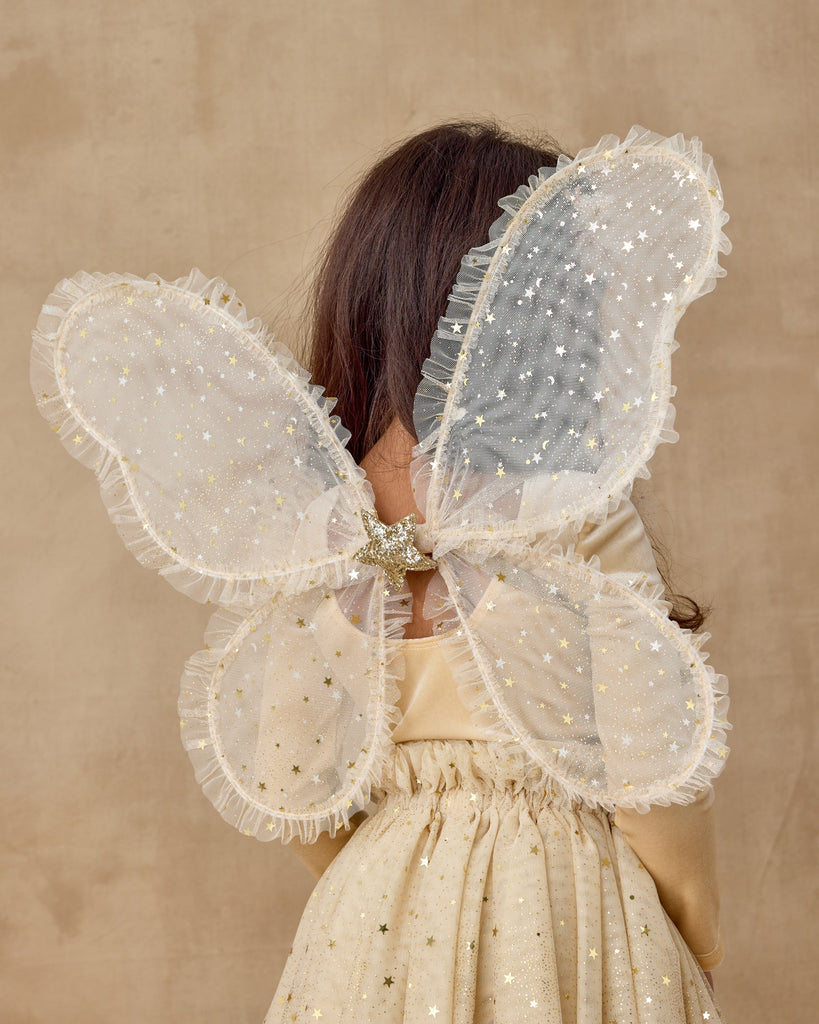 Wings in Champagne Stars by Noralee