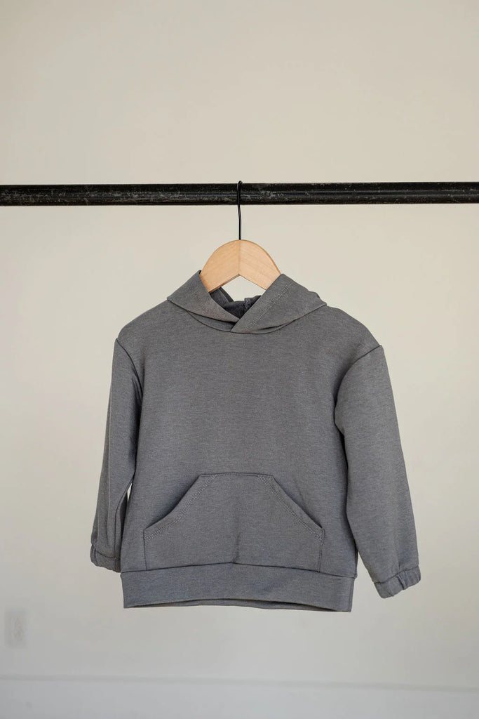 Grey hoodie hanging on a hanger