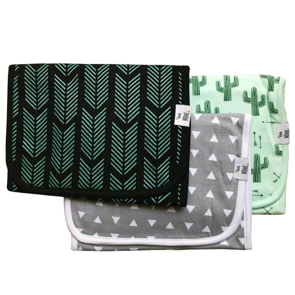 set of three burp cloths. Green, grey and black.