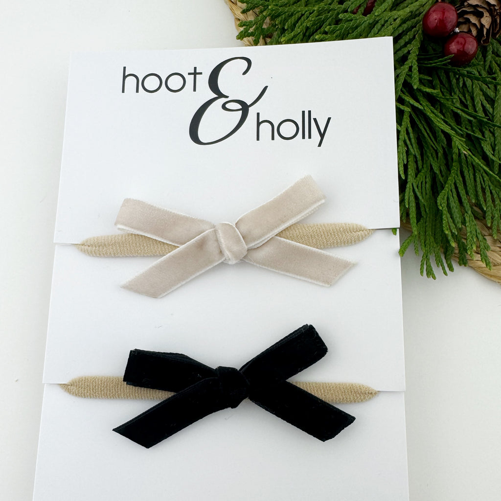 Ivory and black velvet bows flat lay