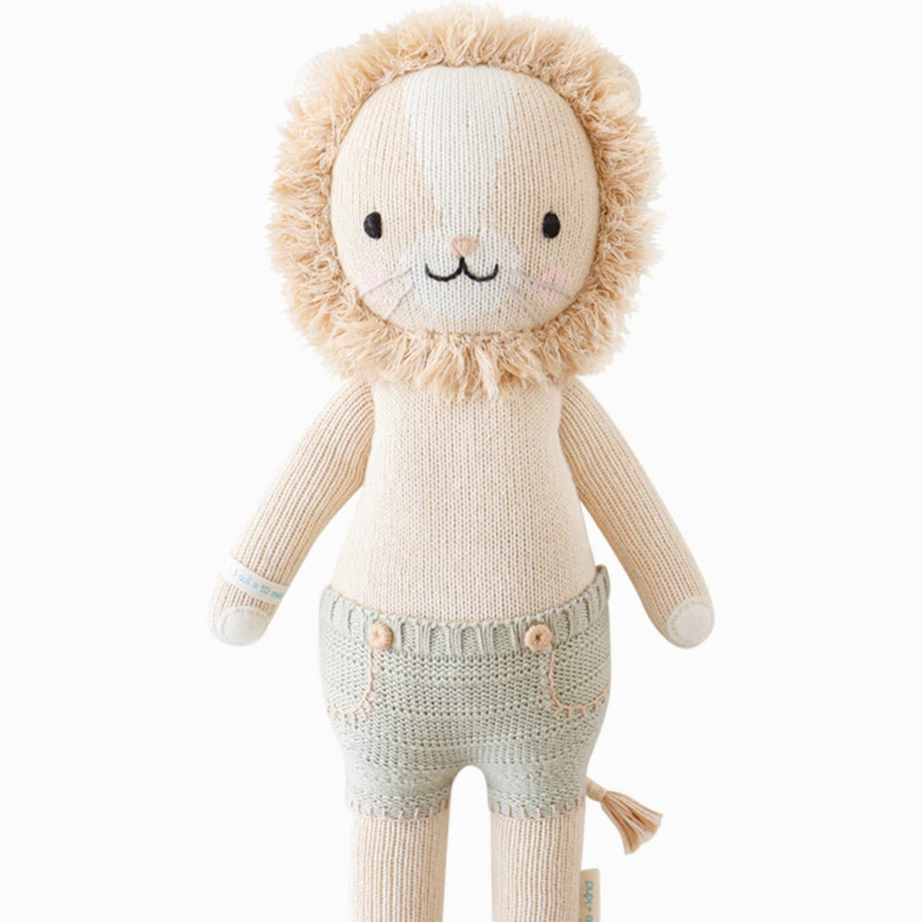 Lion Stuffy wearing Green shorts.