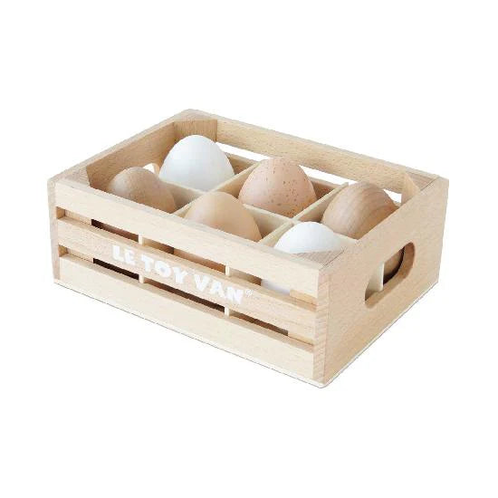 Six wooden eggs in wooden basket
