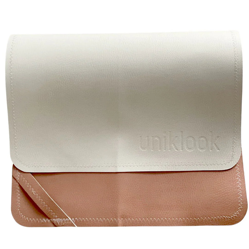 White and beige clutch bag with 'uniklook' branding on a white background