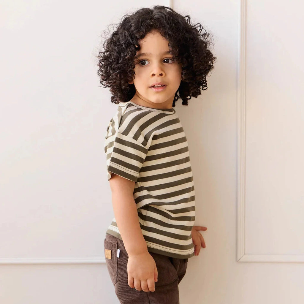 Boy wearing stripe tee shirt and pants