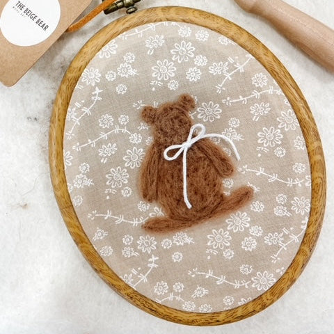 Oval wool bear on floral