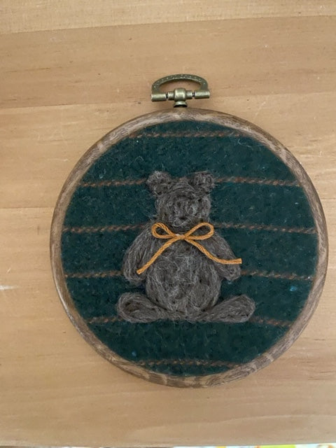 Grey bear wool art on green stripe background