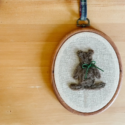 Bear wool art with green bow