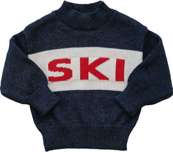 Blue sweater with the ski in red flat lay